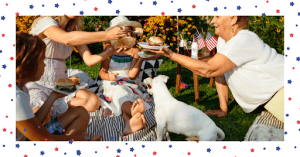 people and a white dog at a 4th of july BBQ
